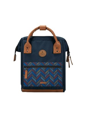 Navy backpack with brown leather accents, herringbone pattern in blue and red on front pocket, top handle, and zip closure.