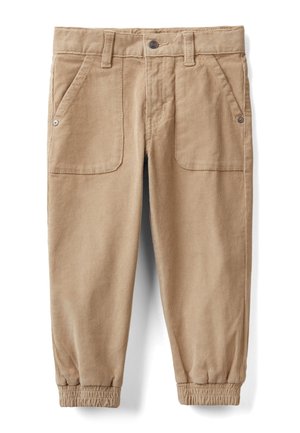Beige kordbukser med elastiske manchetter, fronttrykknap, bæltestropper og to store forlommer med metalnitter.