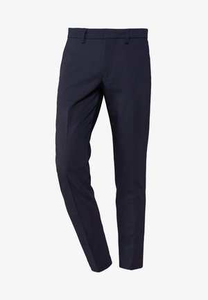 Navy trousers with a slim fit, made from smooth fabric, feature a flat front and belt loops, with a crease running down the front of each leg.