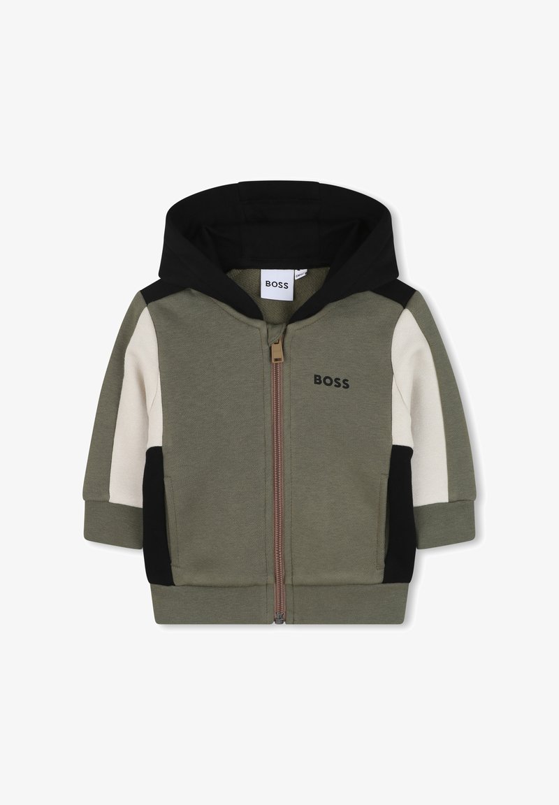 Kaptur na zamek w kolorze oliwkowym, z czarnymi i kremowymi blokami kolorów, teksturowana tkanina oraz złoty zamek z logo na piersi.