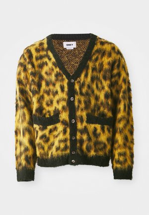 Cardigan cu imprimeu leopard în galben și negru, cu gât în V, buzunare frontale și nasturi pe centru; material texturat, moale.