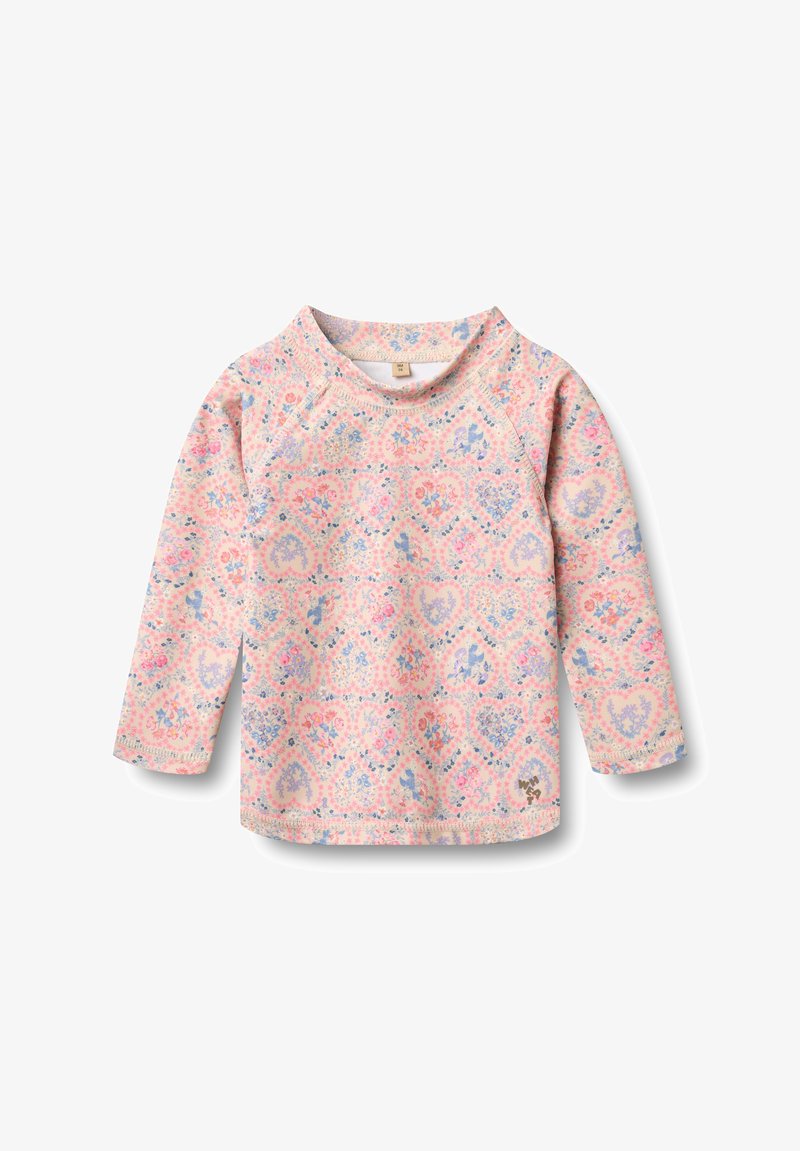 Chemise bébé à manches longues avec des motifs de cœur floraux rose et violet, encolure arrondie et petit logo WHA près de l'ourlet sur fond blanc.