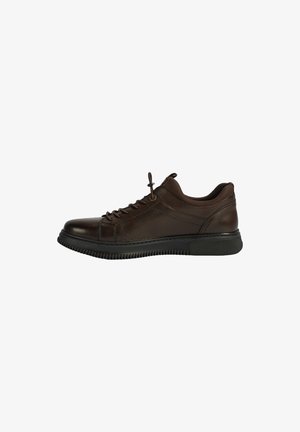 Brown leather sneaker with a rounded toe, flat laces, and textured rubber sole. Features a simple design and subtle stitching detail.