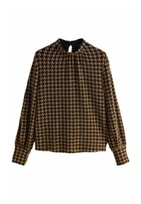 Blouse noire à manches longues avec un motif pied-de-poule beige. Elle présente un col montant avec une fermeture goutte d'eau et des détails froncés aux épaules.