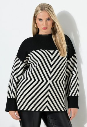 Maglione bianco e nero con un motivo a zigzag, maniche lunghe e scollo rotondo, realizzato in un morbido materiale a maglia testurizzato.