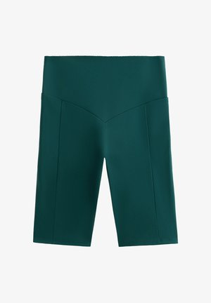 Visoko pasne temno zelene kolesarske hlače z V-oblikovanim šivom spredaj in gladkim, oprijetim materialom.