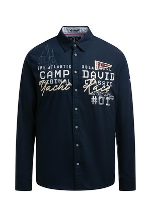 Navy blue long-sleeve shirt with button closure, featuring embroidered text and graphics, including a sailboat design and contrasting accents.