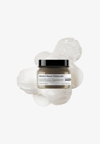 L'Oréal Absolut Repair Molecular haarmasker in een ronde, matte beige pot met een zwarte deksel. Het etiket bevat de productnaam en details. 150 ml.