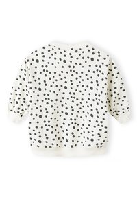 Hvid sweatshirt med sorte prikker, rund halsudskæring og ribbede cuffs og kant. Blødt stof med en struktureret overflade.