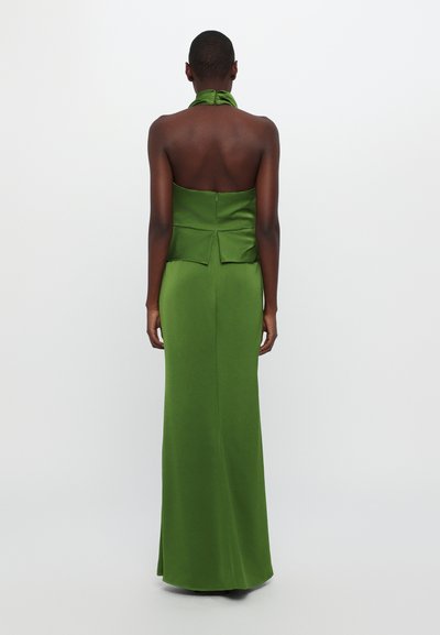 Green satin halter dress with an open back, floor-length design, and a pleated detail at the waist. Smooth texture, form-fitting silhouette.