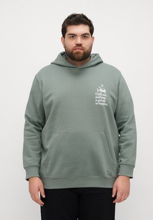 Green hoodie made of soft fabric with a kangaroo pocket. Features a graphic in white text and a casual fit with a drawstring hood.