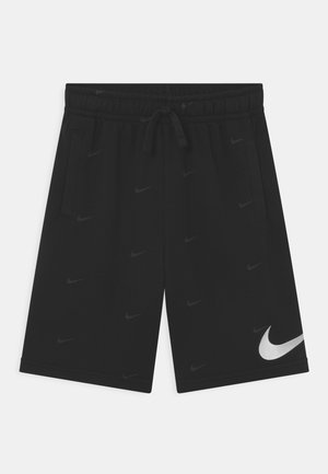 Schwarze Nike-Sportshorts mit einem elastischen Bund, Kordelzug, Seitentaschen und einem großen weißen Nike-Swoosh-Logo nahe dem Saum.