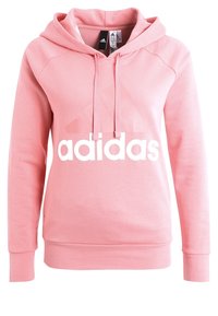 Rosa hoodie med känguruficka, dragsko i huvan och vitt "adidas"-logotyp över bröstet. Tillverkad av mjukt, borstat tyg.