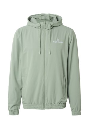 Světle zelená kapucí opatřená bunda na zip s elastickými manžetami a lemem, šňůrkami, postranními kapsami a logem "Sergio Tacchini" na hrudi.
