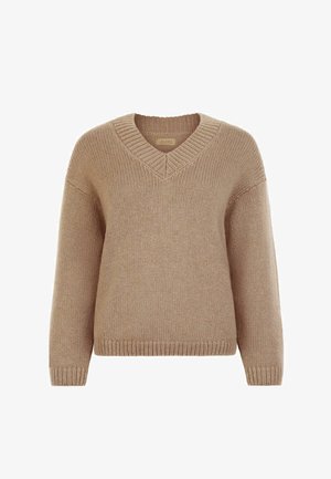 Beżowy sweter z dzianiny z dekoltem w serek, luźnym krojem oraz ściągaczami na rękawach i dole. Miękka faktura, średnia grubość i prosty design.