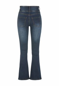 Tummansiniset flared farkut, joissa on korkea vyötärö, kaksi takataskua ja ommellut yksityiskohdat saumoissa. Sujuva rakenne, jossa on vain vähän kulumista.