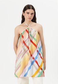 Haut à bretelles multicolore en tissu léger avec des motifs rayés diagonaux dans des teintes pastel et des couleurs vives, présentant une coupe décontractée.
