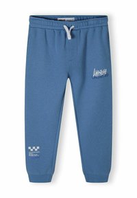 Blå sweatpants gjorda av mjukt tyg med elastisk midja och dragsko. Inkluderar tryckt text och grafiska detaljer framtill och på sidan.