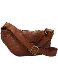 Brązowa skórzana torba na ramię o zakrzywionym kształcie, z zapięciem na zamek i regulowanym paskiem. Posiada dekoracyjne złote detale.