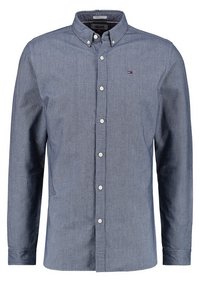 Herrskjorta i blått, med knappar, tillverkad av texturerat tyg, med klassisk krage, långa ärmar och en diskret logotyp på bröstet.
