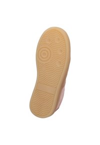 Semelle en caoutchouc avec un motif beige texturé, comportant des points de traction circulaires et hexagonaux ainsi qu'un bord latéral lisse.