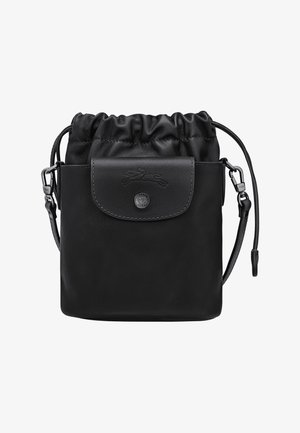 Black leather drawstring bag with a smooth finish, featuring a front flap pocket, logo detail, and an adjustable strap.