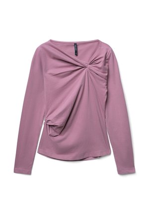 Haut à manches longues en mauve, présentant un design à l'avant tordu, en tissu doux et avec un ourlet arrondi. Style minimaliste avec un effet drapé.