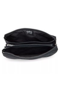 Black zippered pouch with a quilted pattern, featuring a dual compartment interior and a branded label reading "kipling live light" inside.