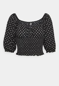 Svart topp med vita prickar, med fyrkantig halsringning, puffärmar och smockad midja. Lättviktsmaterial med en texturerad yta.