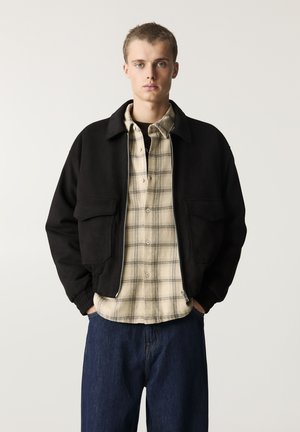 Giacca in similpelle - black