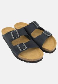 Sandali in pelle nera con due fibbie regolabili, soletta in sughero e suola in gomma testurizzata. Presentano un design open-toe e una soletta piatta.