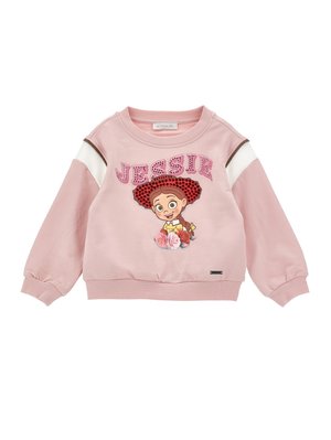 Hanorac roz pentru copii cu personaj de desene animate purtând o pălărie roșie, textul „JESSIE” deasupra și model floral dedesubt, în față.