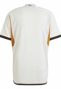 Korte mouwen sporttrui in crème met bruine accenten en een gestructureerde stof. Voorzien van een ronde halslijn en contrasterende zijpanelen.