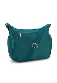 Teal crossbody bag with adjustable strap, front zipper pocket, and two side zippered compartments on a white background.