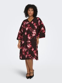 Black dress with red floral pattern, v-neck, and wide sleeves, made from lightweight fabric. Accented with a pleated texture.