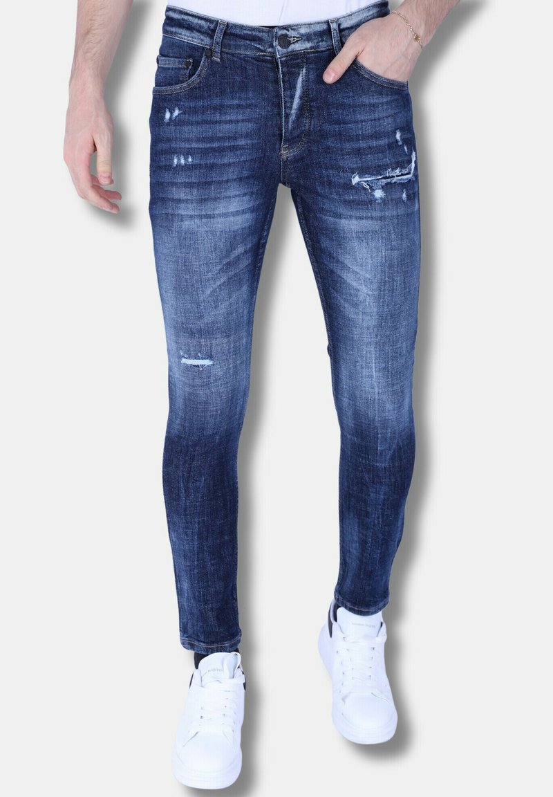 Skinny-fit herenjeans in donkerblauw denim met versleten details en lichte vervaging, met vijf zakken en een ritsopening.