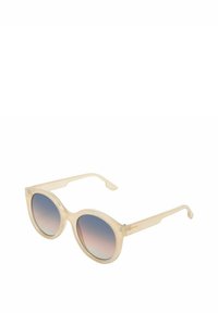 Occhiali da sole rotondi con una montatura traslucida beige, lenti azzurro sfumate e aste dritte. Presentano una finitura lucida e dettagli hardware minimi.