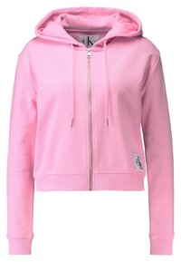 Roze cropped hoodie met een rits aan de voorkant, trekkoorden, geribde manchetten en zoom, en een klein logo-opdruk. Van katoen, zachte textuur.
