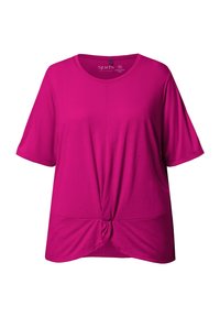 Top fucsia de manga corta con escote redondo y detalle de nudo en la parte delantera. Tejido suave con un corte relajado.