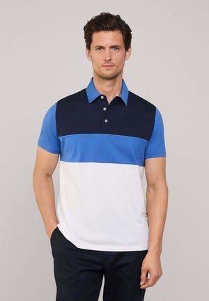 Poloshirt mit einem blau und marinefarbenen Farbblockdesign. Kurze Ärmel, mit Kragen, drei Knöpfen und seitlichen Details, aus einem Baumwoll-Mix gefertigt.