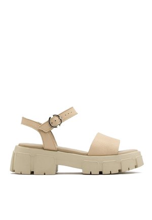 Beige leren plateau sandalen met verstelbare enkelriem, dikke gestructureerde zool, open teen en minimalistisch ontwerp.