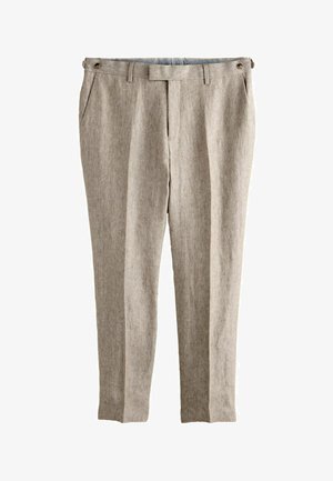 Beige hørslanke bukser med sidelommer, bæltestropper og knappede justerbare stropper ved taljen.