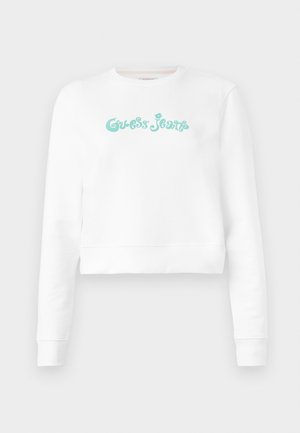 Sweatshirt curto branco feito de um tecido suave, com o logótipo em texto turquesa "Guess Jeans" a atravessar o peito, mangas longas e punhos canelados.