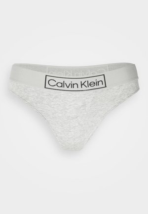 Sivi Calvin Klein tanga s mekim tekstilom i kontrastnom logom. Ima minimalistički dizajn s niskim strukom.