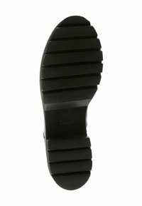Suola in gomma nera con scanalature e righe profonde, che offre trazione e grip. Il design presenta un tacco arrotondato e bordi piatti.