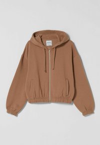 Brun kort hoodie med dragkedja fram, justerbar huva, elastiska ärmslut och nederkant samt sidofickor.