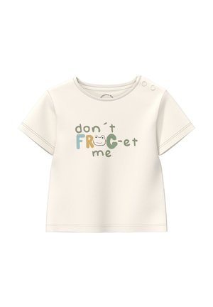 Chemise pour bébé à manches courtes couleur crème avec des boutons-pression sur l'épaule, portant le texte "n'oublie pas la GRENOUILLE" avec un petit visage de grenouille dans le mot.