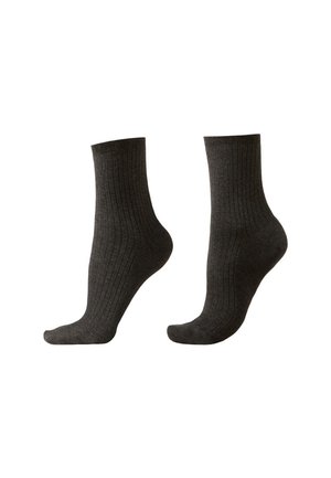 Paire de chaussettes montantes côtelées gris foncé présentées côte à côte sur un fond blanc.