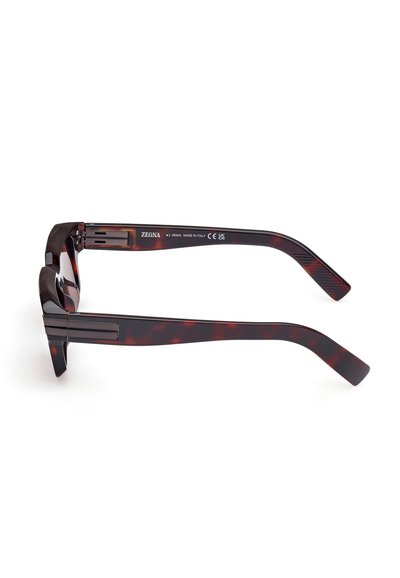 Tortoiseshell sunglasses with a smooth finish, wide straight arms, and subtle branding on the inside. Italian design, featuring CE marking.