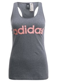 Grijze Adidas mouwloze tanktop met roze logotekst en stoflabels bevestigd aan de halslijn.